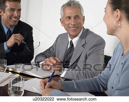 Three business colleagues in conference meeting View Large Photo Image Stock Image - Three business colleagues in conference meeting. Fotosearch