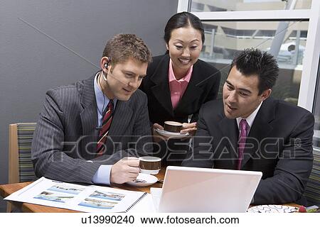 Three business people having meeting at lunch View Large Photo Image Stock Image - Three business people having meeting at lunch. Fotosearch