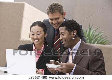 Three business people having meeting View Large Photo Image Stock Image - Three business people having meeting. Fotosearch