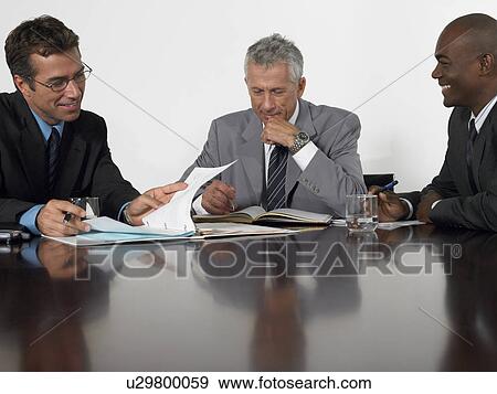 Three businessmen in conference meeting View Large Photo Image Stock Photo - Three businessmen in conference meeting. Fotosearch