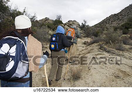 Three people hiking View Large Photo Image Picture - Three people hiking. Fotosearch