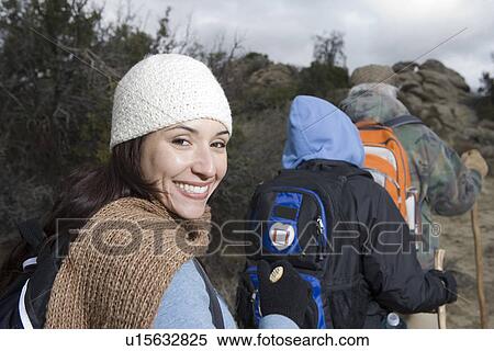 Three people hiking View Large Photo Image Stock Photography - Three people hiking. Fotosearch