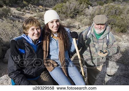 Stock Photo - Three people on hiking trip, portrait. Fotosearch