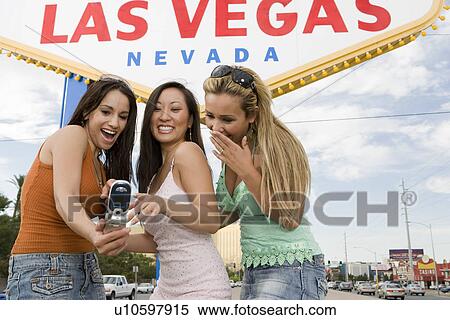 Three women taking picture in front of Las Vegas welcome sign, Nevada, USA View Large Photo Image Stock Photography - Three women taking picture in front of Las Vegas welcome sign, Nevada, USA. Fotosearch