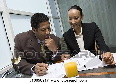 Stock Photo - Two business people at business meeting. Fotosearch