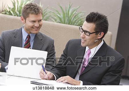 Two businessmen having meeting View Large Photo Image Stock Photo - Two businessmen having meeting. Fotosearch