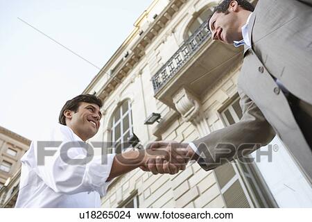 Two Businessmen Shaking Hands View Large Photo Image Picture - Two Businessmen Shaking Hands. Fotosearch
