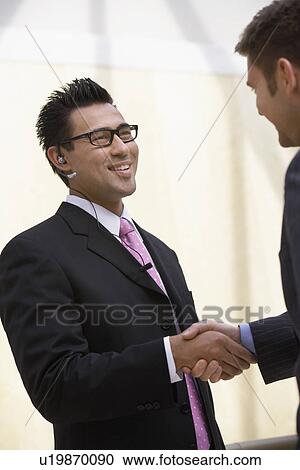 Two Businessmen Shaking Hands, half-length View Large Photo Image Stock Image - Two Businessmen Shaking Hands, half-length. Fotosearch