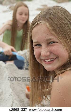 Two Girls Playing on Beach View Large Photo Image Stock Photo - Two Girls Playing on Beach. Fotosearch