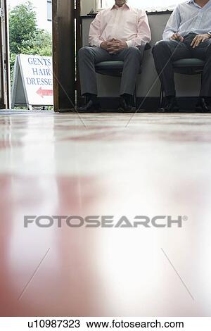 Two male customers waiting in barber shop View Large Photo Image Stock Image - Two male customers waiting in barber shop. Fotosearch
