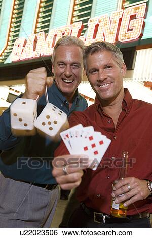 Two men and man in front of casino building View Large Photo Image Stock Photograph - Two men and man in front of casino building. Fotosearch