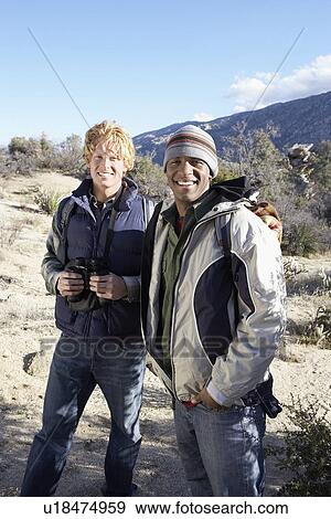 Two Young Men Hiking in hills, portrait. View Large Photo Image Stock Photo - Two Young Men Hiking in hills, portrait.. Fotosearch