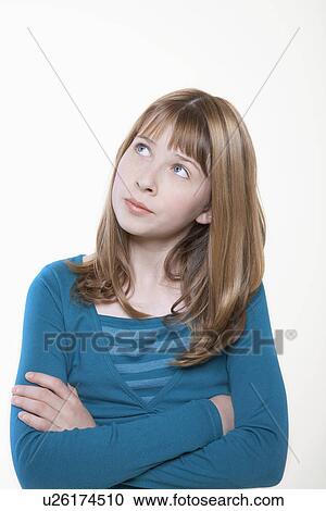 Unhappy-looking teenage Girl, arms crossed, looking away View Large Photo Image Stock Image - Unhappy-looking teenage Girl, arms crossed, looking away. Fotosearch