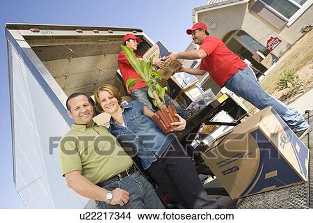 Unloading removal van in front of house View Large Photo Image Picture - Unloading removal van in front of house. Fotosearch