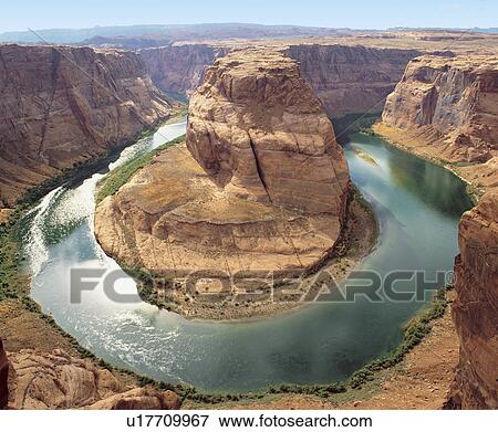Water surrounding rock formation, elevated view View Large Photo Image Stock Photo - Water surrounding rock formation, elevated view. Fotosearch