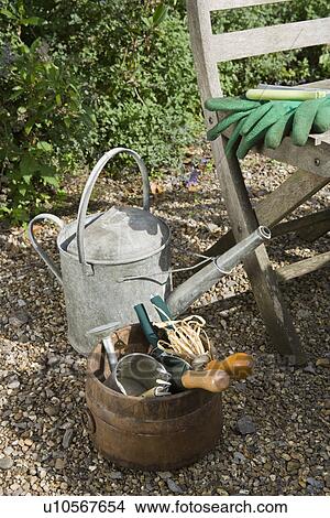 Watering Can and Garden Tools View Large Photo Image Picture - Watering Can and Garden Tools. Fotosearch