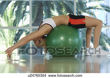 Woman Bending Backwards Over Exercise Ball View Large Photo Image Picture - Woman Bending Backwards Over Exercise Ball. Fotosearch