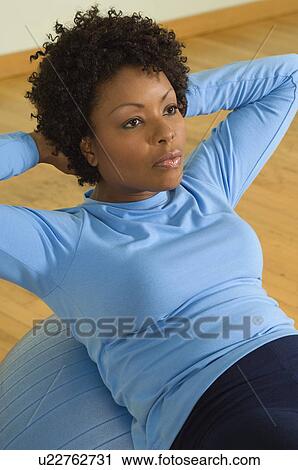 Woman Doing Sit-Ups With Exercise Ball View Large Photo Image Stock Image - Woman Doing Sit-Ups With Exercise Ball. Fotosearch
