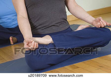 Woman in Lotus Posture in Yoga Class View Large Photo Image Stock Photo - Woman in Lotus Posture in Yoga Class. Fotosearch