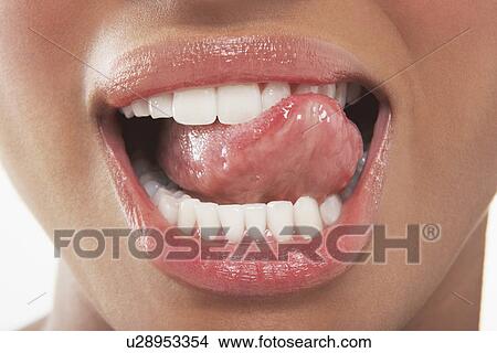 Woman Licking Her Teeth View Large Photo Image Picture - Woman Licking Her Teeth. Fotosearch
