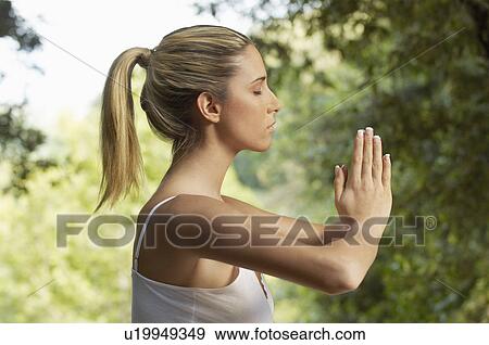 Woman meditating, profile View Large Photo Image Stock Photo - Woman meditating, profile. Fotosearch