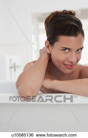 Woman relaxing in bathtub, portrait View Large Photo Image Stock Photograph - Woman relaxing in bathtub, portrait. Fotosearch