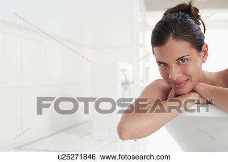 Woman relaxing in bathtub, portrait View Large Photo Image Stock Photograph - Woman relaxing in bathtub, portrait. Fotosearch