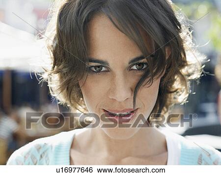 Woman smiling, outdoors, portrait View Large Photo Image Stock Photograph - Woman smiling, outdoors, portrait. Fotosearch