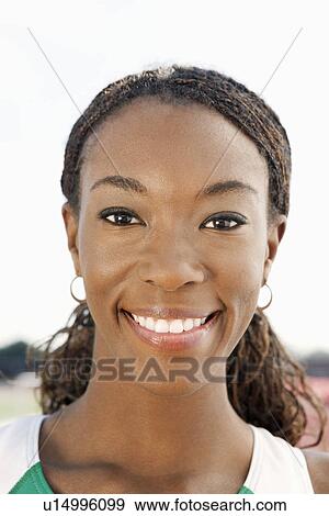 Stock Photo - Woman smiling, portrait. Fotosearch