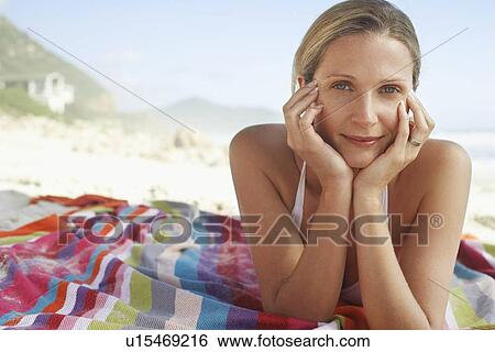 Woman Sunbathing on Beach View Large Photo Image Stock Photograph - Woman Sunbathing on Beach. Fotosearch