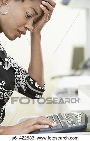 Woman using computer in office View Large Photo Image Stock Image - Woman using computer in office. Fotosearch