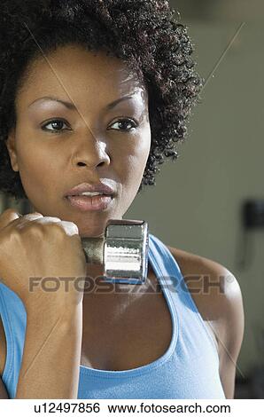 Woman Weightlifting With Dumbbell View Large Photo Image Stock Photograph - Woman Weightlifting With Dumbbell. Fotosearch