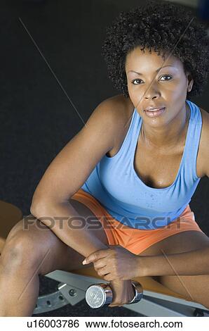 Woman Weightlifting With Dumbbell View Large Photo Image Stock Photograph - Woman Weightlifting With Dumbbell. Fotosearch