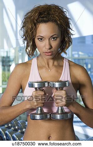 Woman Weightlifting With Dumbbells View Large Photo Image Stock Image - Woman Weightlifting With Dumbbells. Fotosearch