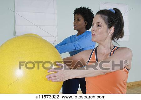 Stock Image - Women in Exercise Class. Fotosearch