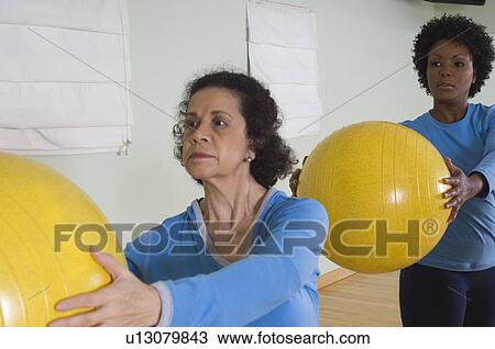 Stock Image - Women in Exercise Class. Fotosearch