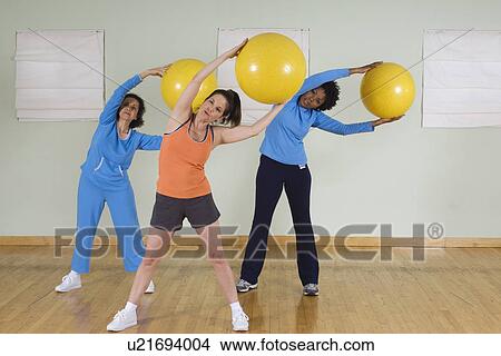 Picture - Women Using Exercise Balls in Fitness Class. Fotosearch