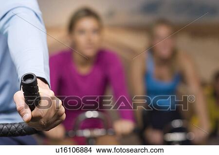 Women Working Out on Exercise Bicycles at Gym View Large Photo Image Picture - Women Working Out on Exercise Bicycles at Gym. Fotosearch
