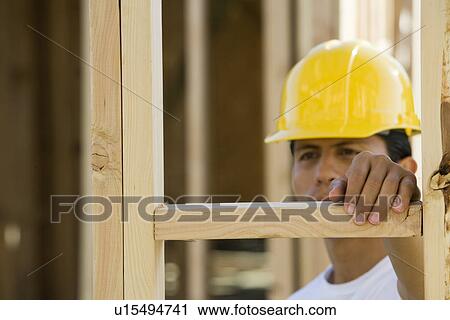 Stock Image - Worker in construction site. Fotosearch