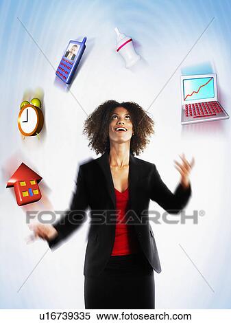Working mother juggling responsibilities View Large Photo Image Stock Photography - Working mother juggling responsibilities. Fotosearch