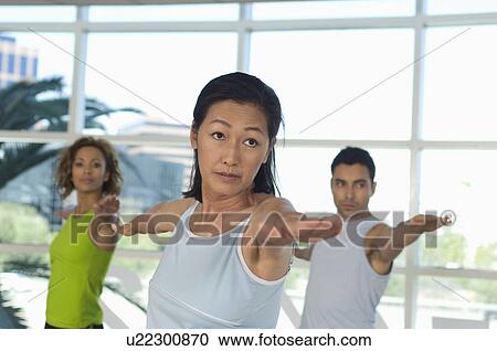 Stock Image - Yoga Class at Health Club. Fotosearch