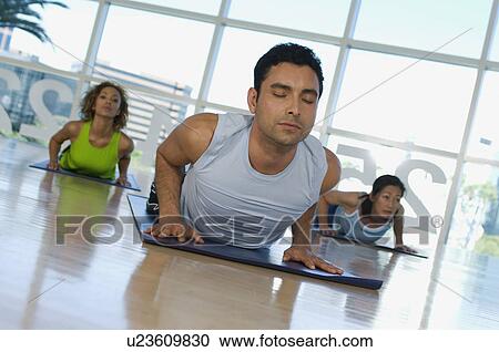 Stock Image - Yoga Class at Health Club. Fotosearch