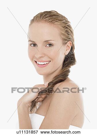 Young Blonde Woman in bath towel holding wet hair, portrait View Large Photo Image Stock Photo - Young Blonde Woman in bath towel holding wet hair, portrait. Fotosearch