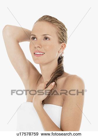 Young Blonde Woman in bath towel holding wet hair View Large Photo Image Stock Photo - Young Blonde Woman in bath towel holding wet hair. Fotosearch