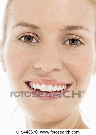 Stock Image - Young blonde Woman Smiling, portrait, close up. Fotosearch