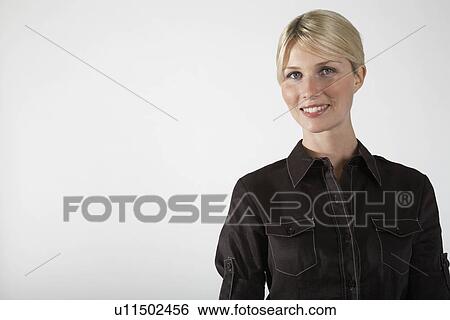 Stock Photograph - Young businesswoman, on white background, portrait. Fotosearch