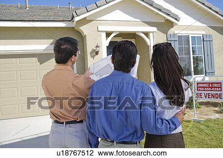 Young couple buying house View Large Photo Image Stock Image - Young couple buying house. Fotosearch