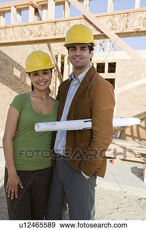 Young couple in construction site View Large Photo Image Stock Photo - Young couple in construction site. Fotosearch