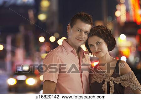 Stock Image - Young couple in the City at Night, portrait. Fotosearch