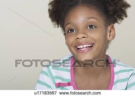 Young Girl smiling, close-up View Large Photo Image Stock Photo - Young Girl smiling, close-up. Fotosearch